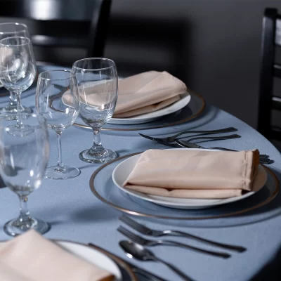 Wedding Decor Rental - Light Blue table Polyester Linen with clear charger with gold rim below a ivory napkin